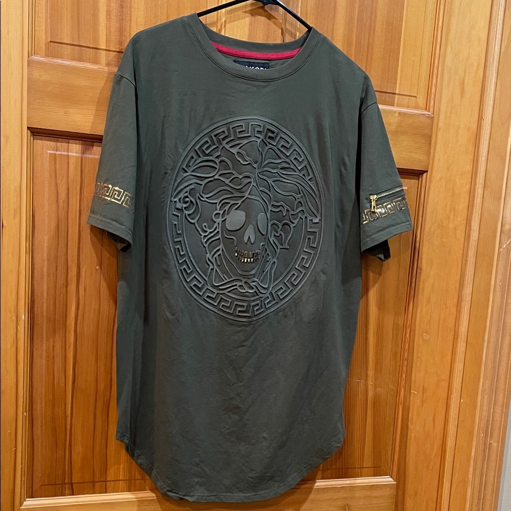 MAKOBI OLIVE SKULL TEE WITH GOLD GREEK KEY, TEETH, SIDE ZIPPER DETAIL Size L